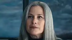 Harmony Cobel, a character from Severance. She has medium-length gray hair and is slightly smiling.