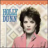 colorized pink-turoquoise-sepia photo of Holly Dunn with southwestern native patterns in background