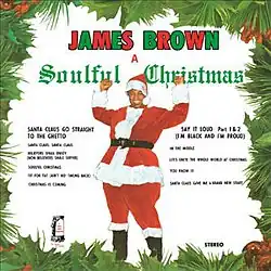 James Brown in a Santa Claus outfit raising his arms in joy seen within a Christmas wreath with the song titles to his left and right.