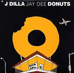 A donut shop with a giant bitten-donut sign centers the digital artwork, while an airplane is on the top right and two lampposts are on opposing sides