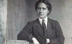 Image of Gutiérrez leaning against a chair