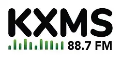 Black text reading "KXMS 88.7 FM" with a green audio visualizer