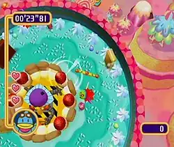 This screenshot shows the Helibokaan flying in a circular arena, attacking the barrier protecting Professor Isogashima. The game's interface displays the time, coin counter score, and Kururin with all three of his hearts remaining.