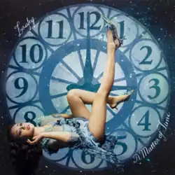 Laufey in a blue dress and silver heels positioned on her back in front of a large clock face, her bare legs showing