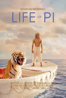 A young man and a tiger are in a boat at sea.