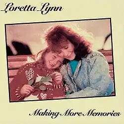 framed photo of Loretta Lynn and granddaughter Megan on yellow background