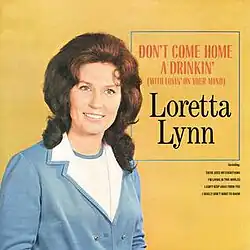 album cover photo of Loretta Lynn on dark yellow background