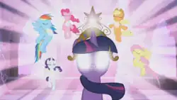 Twilight Sparkle (center) with glowing eyes and a golden tiara (element of magic) and her friends Applejack, Fluttershy, Rarity, Rainbow Dash, and Pinkie Pie (clockwise from top right), who are wearing glowing, golden necklaces