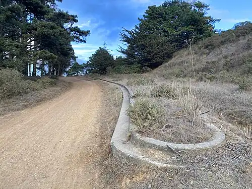 The original median at the beginning of Marincello Trail. The right hand side of the original boulevard has been overgrown with vegetation. This is evidenced by an aerial photo from 1968.[7]
