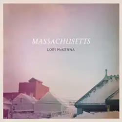 color photo of sky and rooftops with title and artist text