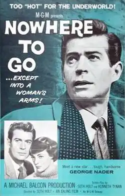 Film poster with a man in a suit and scarf looking serious, with a smaller image of him beside a woman below, and text reading "Nowhere to Go... except into a woman's arms!"