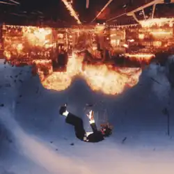 An image of a city exploding with Offset falling in opposite direction.