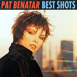 photo of Pat Benatar looking back over shoulder with blurred urban reflection in backround