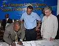 HEART Trust/NTA's previous Executive Director, Donald Foster, signs