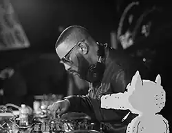 Madlib performing in San Francisco in 2018 with Lord Quas drawn next to him