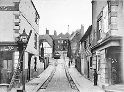 Photograph of Queen Street in Chatham, with the Three Cups pub on the left. The building on the right was a grocer's until 1909, after which it became the Rob Roy.