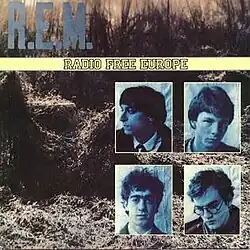 A picture of a field of kudzu with the word "R.E.M." in light blue written across the top, a yellow band in the middle that reads "RADIO FREE EUROPE" and a montage of blue-tinted photographs of the members of R.E.M. in the bottom-right corner (clockwise, from top-left): Peter Buck, Mike Mills, Michael Stipe, and Bill Berry