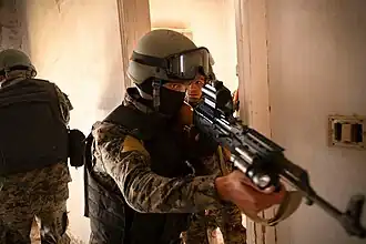 SDF Commandos receiving CQB (close quarters combat) training from U.S. Army personnel