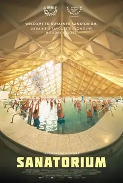 Poster for the film "Sanatorium" showing a group of people exercising in a large indoor pool under a geometric wooden ceiling with warm lighting.