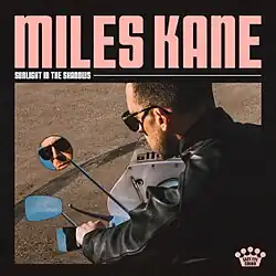 The album cover depicts Miles Kane looking outside of a window