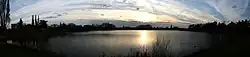 A panoramic photography picture showing Sandhill Lake at sunset on 20 April 2014.