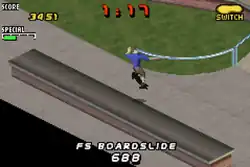 A horizontal screenshot featuring a digital representation of a skate park with a skater jumping from a long flat concrete structure. The words "Score: 3451, 1:17" are at the top of the screen while "FS Boardslie: 688" is at the bottom.