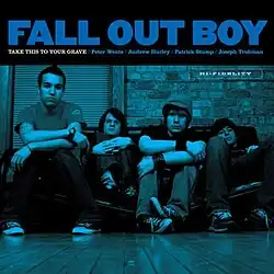 A blue-tinted image of the band members sitting on a broken futon placed against a brick wall. At the top reads the artist name in large blue text and below reads the album title in white, and the names of the band members in blue, separated by slashes in between. In the right corner of the image reads "Hi-Fidelity".