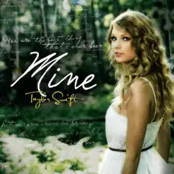 Cover art of "Mine", showing Taylor Swift in a sleeveless white dress, looking backwards