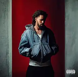 Cole standing in front of a wall