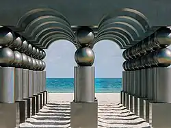 Two halls of portals made of iridescent gray marble at the beach, with the sea as their backdrop