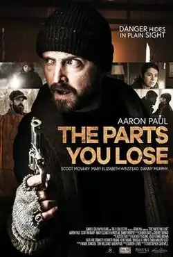 Aaron Paul in character with heavy clothing and a gun, framed by four screenshots of other characters in the film.