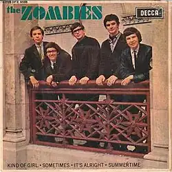 British pop quintet the Zombies posing for the cover shop of their eponymous 1965. The band are leaning over a railing, with green text reading their name visible in the top left corner.