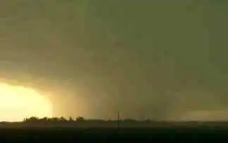 Grainy photograph of the tornado viewed across the Mississippi River