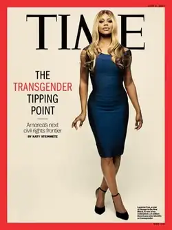 Front cover of a June 2014 issue of Time magazine, featuring a full-body photo of Laverne Cox. Cox is wearing a blue dress and is standing against an off-white background.