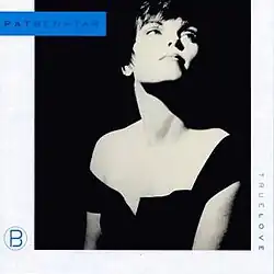 black and white half-length photo of Pat Benatar looking up