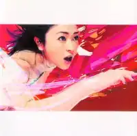 A picture of Hikaru Utada, with their hand extending outwards. Pink, red, and orange digitalized patterns of geometric shapes are placed behind them.
