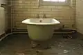 A bathroom within one of the wards close to the main hall, which is in a poor state.