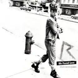 Black-and-white photo of Rihanna folding her arms while walking