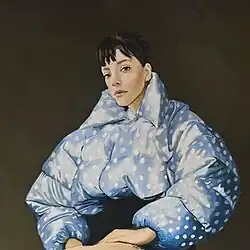 A painting of Lily Allen wearing a light blue and white polka dot coat.