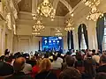 Conférence sur l'investissement en 2025 dans le salon d'honneur au 2ᵉ étage.