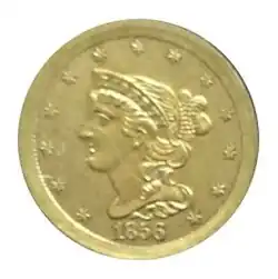 Pièce de monnaie représentant le profil gauche d'une femme aux cheveux longs, portant un bonnet, le tout entouré de treize étoiles.
