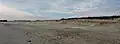 Plage des Sables Blancs : recul de la dune sous l'action de l'érosion en dépit des mesures de protection prises.