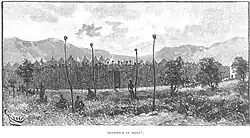 Boma (enceinte fortifiée) de M'Siri à Bunkeya. On voit les crânes d'ennemis vaincus fichés sur les perches et le sommet des palissades. Gravure de 1892.