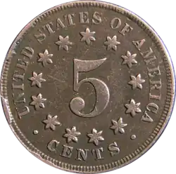 Pièce de monnaie avec le chiffre 5, au centre, entouré de treize étoiles.