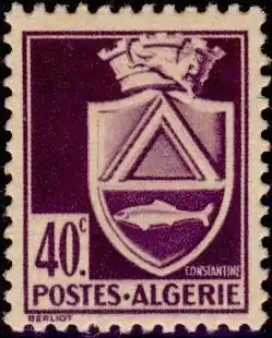 Photographie d'un timbre postal imprimé en violet sur papier chamois.