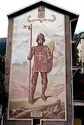 Fresque dédiée à saint Maurice sur la place du marché, avec la devise « en adversité, bon cœur », ajoutée au blason de la ville en 1565 par le duc Emmanuel-Philibert.