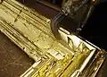 Dorure à la feuille d'or sur bois : lissage à l'agate