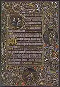 Page à médaillons marginaux du Buisson ardent et d'Aaron et une lettrine historiée représentant la Nativité.