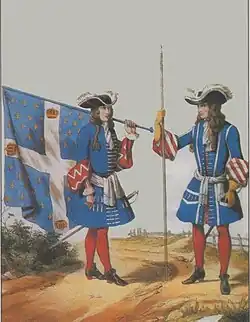 Habillement du régiment des Gardes Françaises en 1697. Habit bleu, parements rouges garnis d'éléments blancs.
