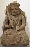 Śiva. Région de Kon Tum. Style de Yang Mum. Vers 1409. H. 85&nbsp;cm. Musée Guimet[122]